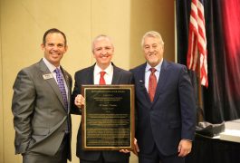 Dr. Thacker receiving his award from IAPSS