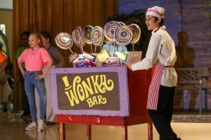 elementary students perform in Willy Wonka the Musical